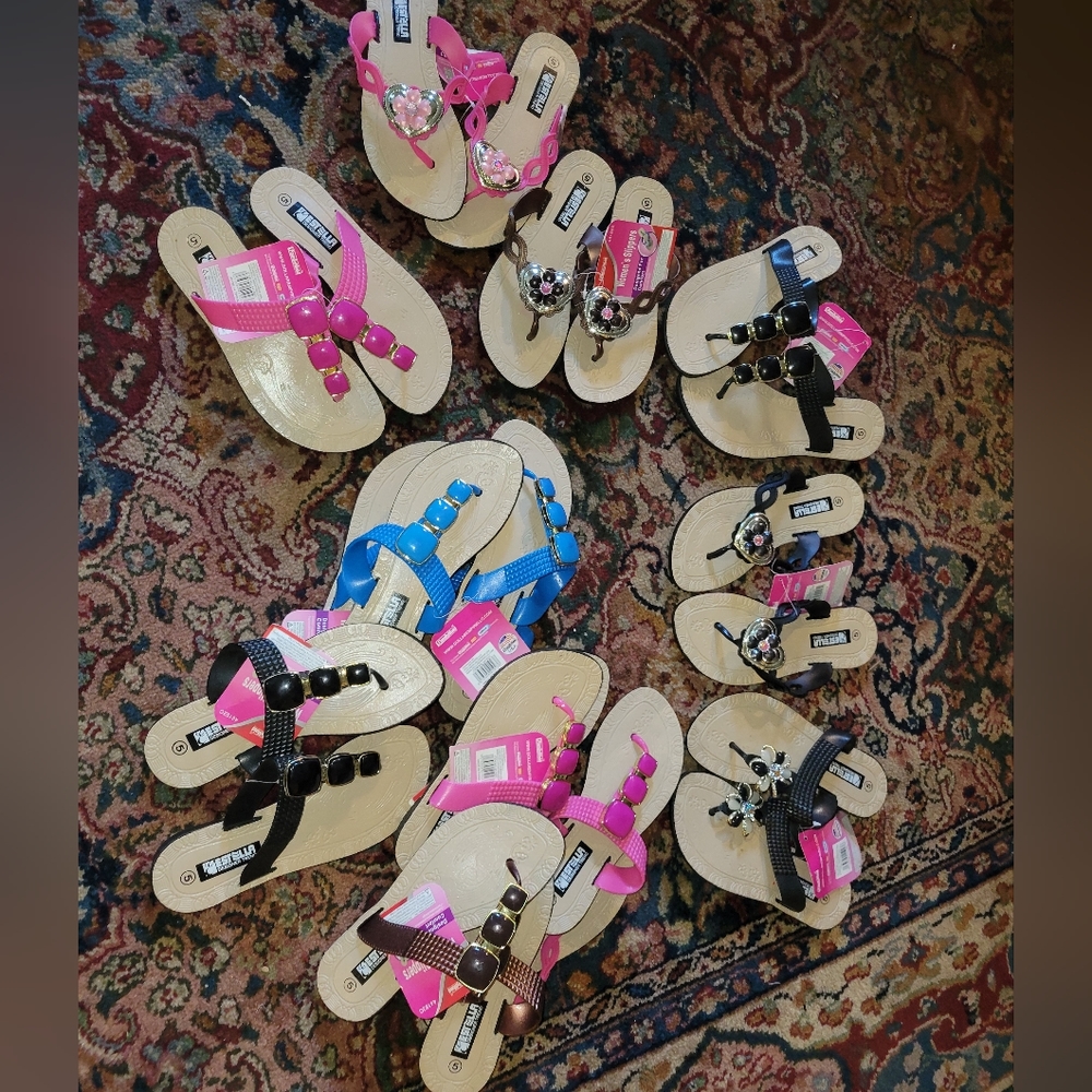Lot of a dozen pairs of new flip flops